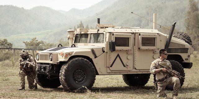 army operation in the forest with armored vehicle